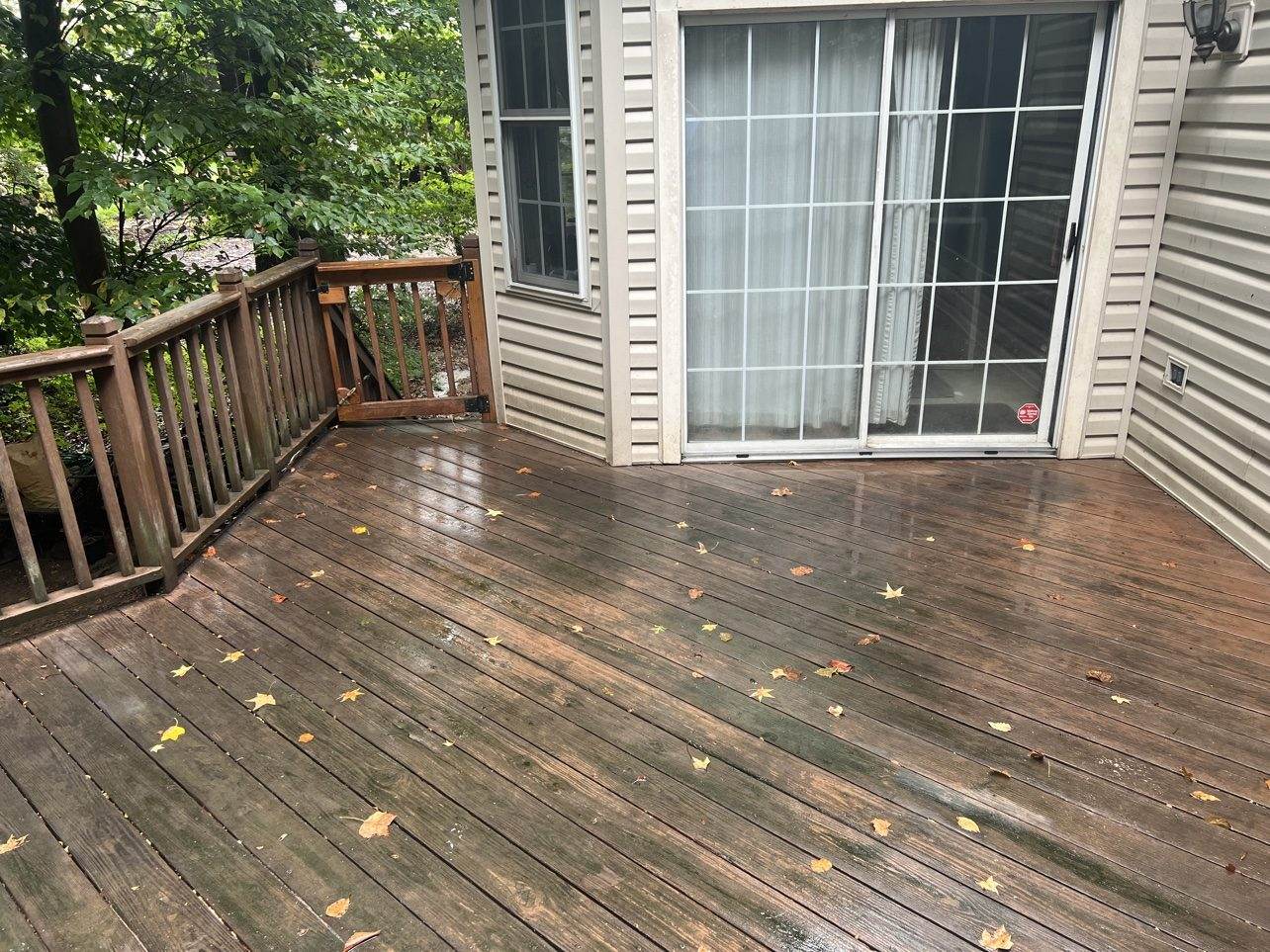 A pressure-treated deck that has grayed and picked up years of surface grime — the kind of cosmetic wear restoration handles well.