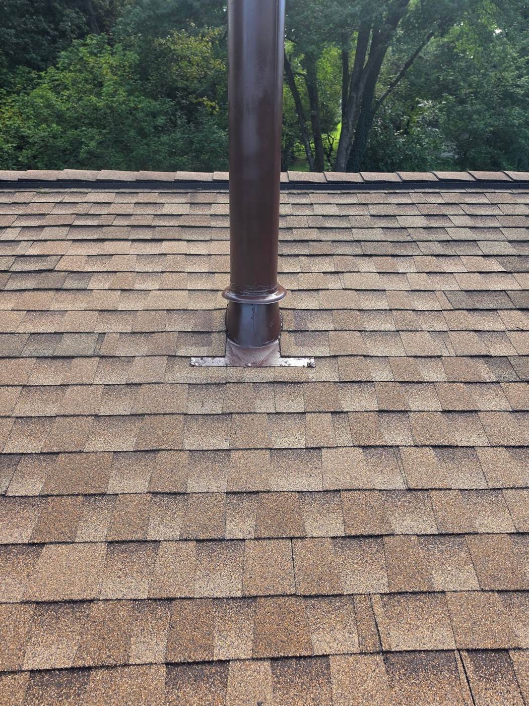 A close-up of a plumbing vent pipe — a worn pipe boot around one of these is one of the most common and affordable roof repairs.