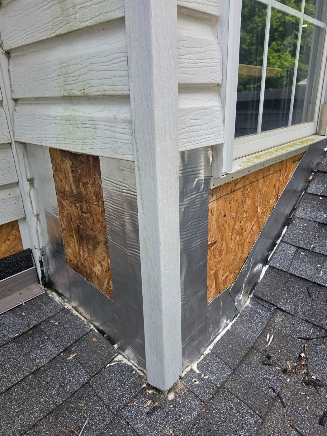Dormer flashing being repaired with ice-and-water shield underneath — proper underlayment is what makes a flashing repair last.